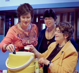 Gayla Rummans, Laurie Brown and Margie Bleuer prepare refreshments