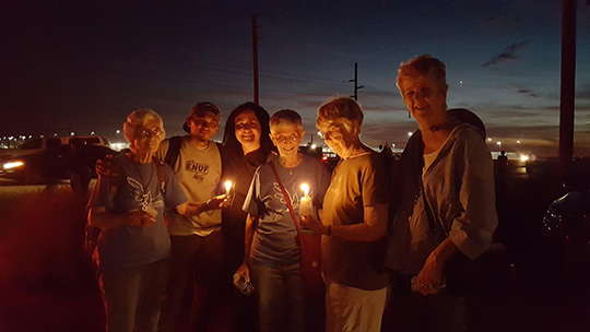 8th Day Center for Justice staff at vigil for migrants at Eloy Detention Center