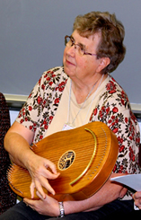 Sister Carrie Kirsch plays the Reverie Harp during a breakout session