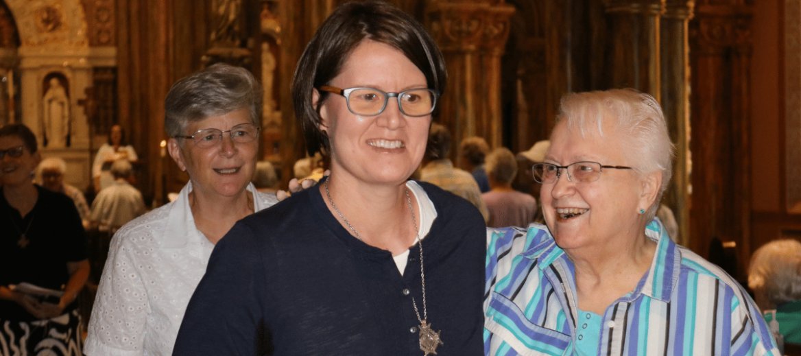 Sister Michele and Sister Lisa smile as they process out of Mary of the Angels Chapel