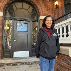 Sister Corrina Thomas stands on the steps to the door of the novitiate house in Chicago