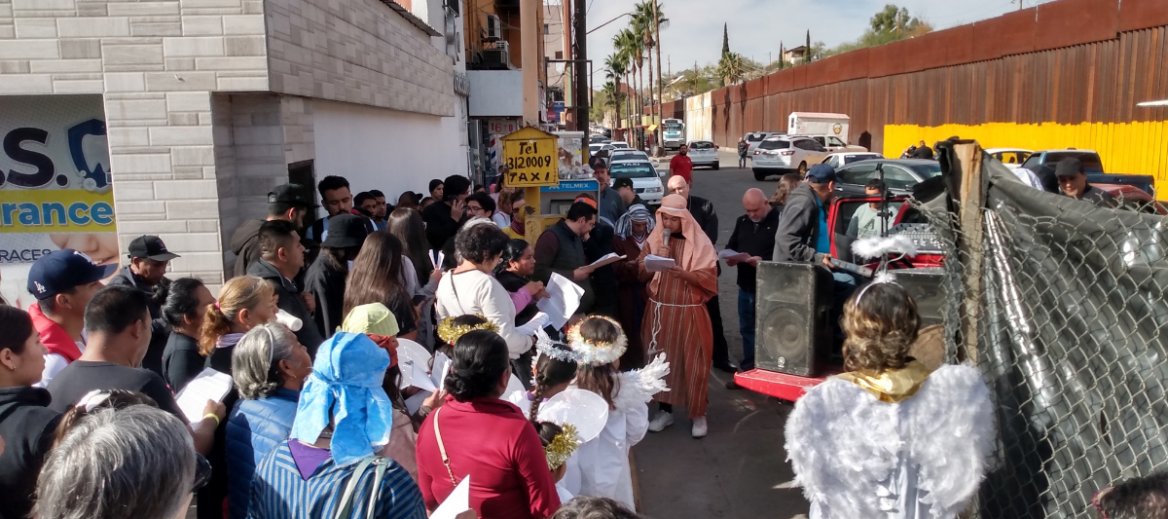 people dressed as angels and members of the Nativity scene for posada in Nogales Mexico