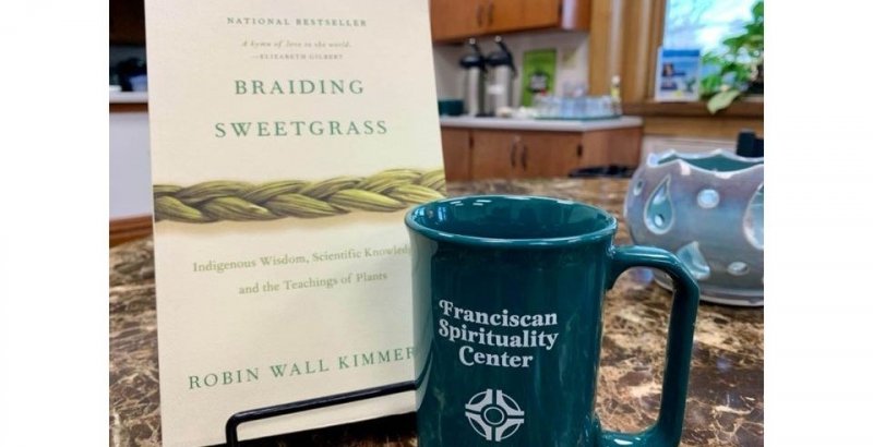 Braiding Sweetgrass book and Franciscan Spirituality Center coffee mug
