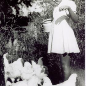 Sister Thea Bowman feeding chickens