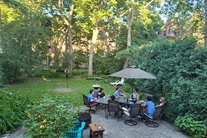 guests gathering in the backyard of the fireplace