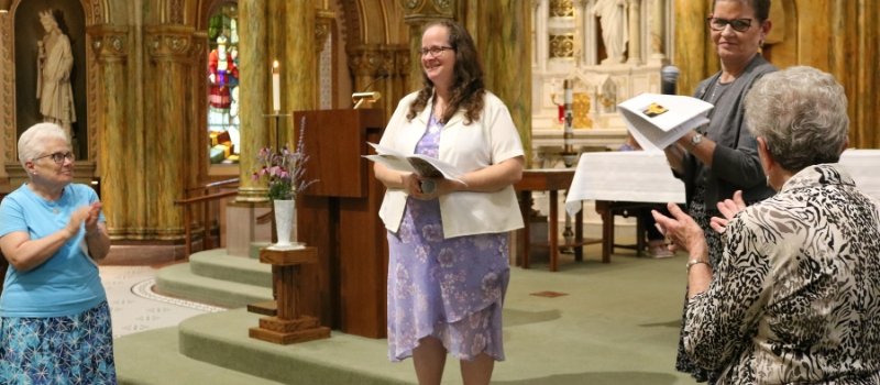 Sister Karen, Sister Meg, Sister Sue and Sister Georgia stand on the altar of Mary of the Angels Chapel