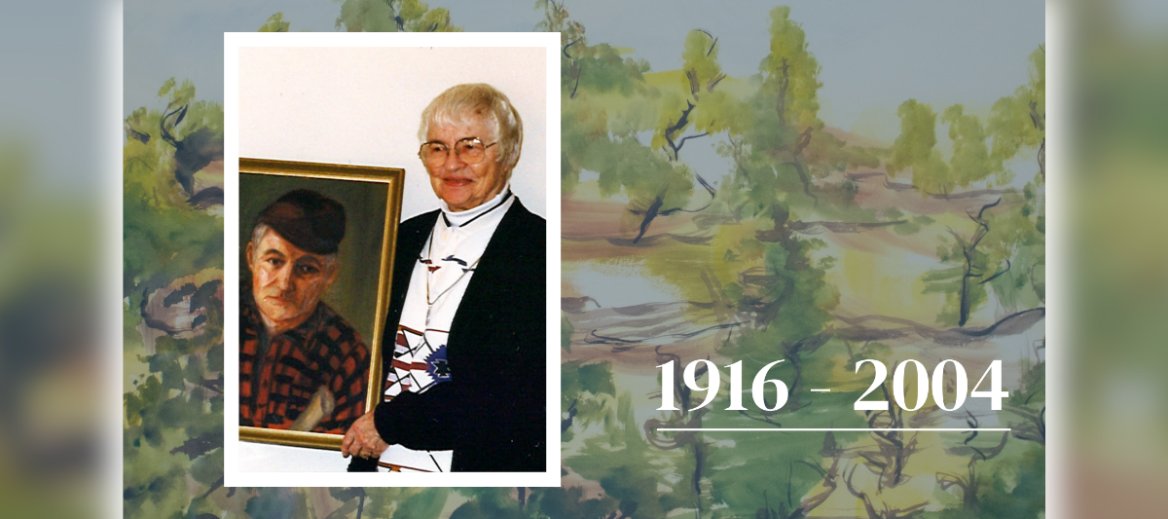 Picture of a woman with short white hair, glasses, white shirt and black sweater holding painting of man with a black hat and black and red checked shirt over a watercolor landscape image