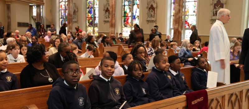 people fill the church pews inside the cathedral of st peter the apostle in jackson mississippi