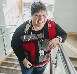 Sister Theresa Keller poses on clinic stairway