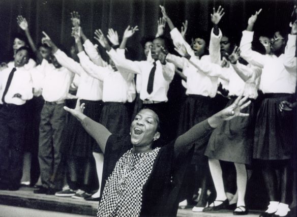 black-woman-children-singing-arms-raised