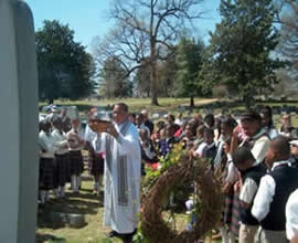 Father Maruice Nutt presides at memorial Mass