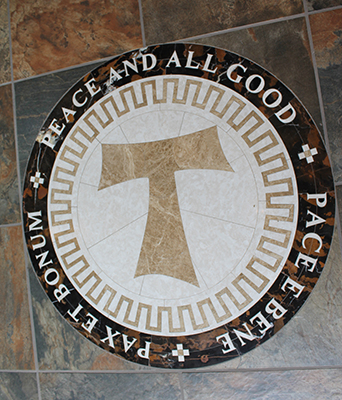 Tau cross in entry to San Damiano Chapel Viterbo campus