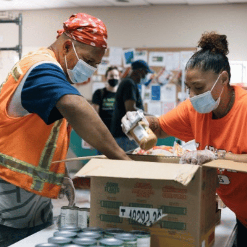 two people packing food at the food pantry in chicago's north lawndale area