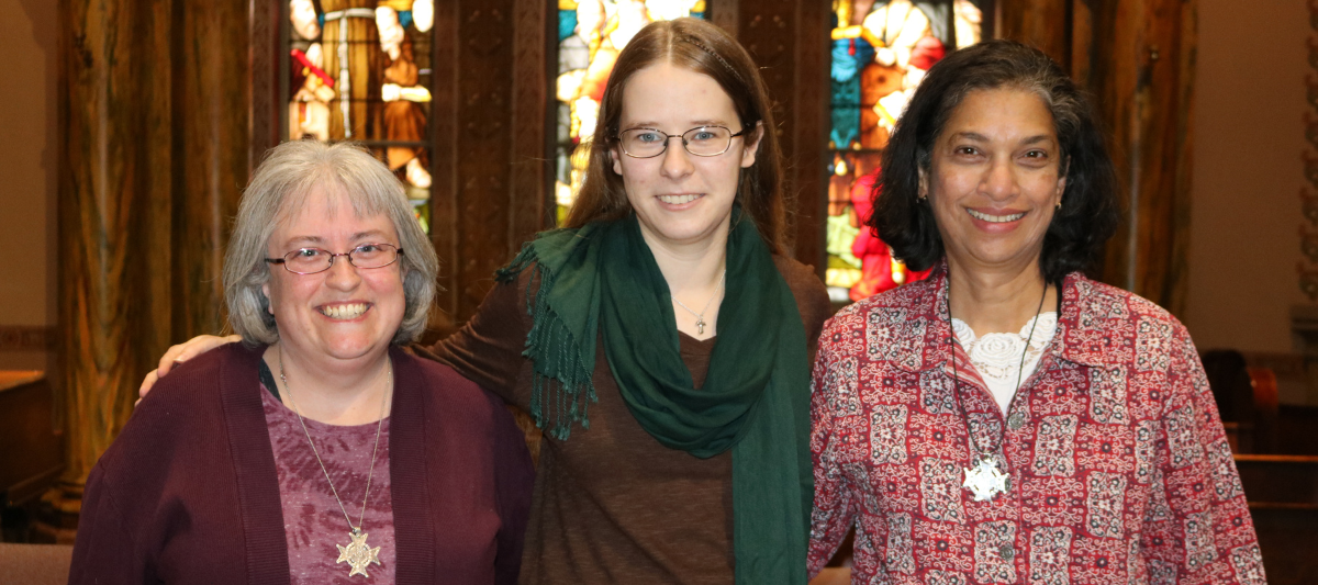 Franciscan Sisters Amy Taylor and Corrina Thomas pose with Anna Taylor, who is in the middle