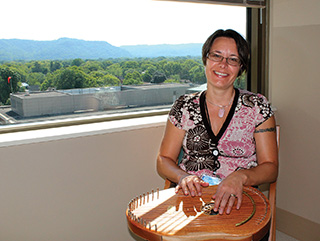 Krista playing Reverie Harp
