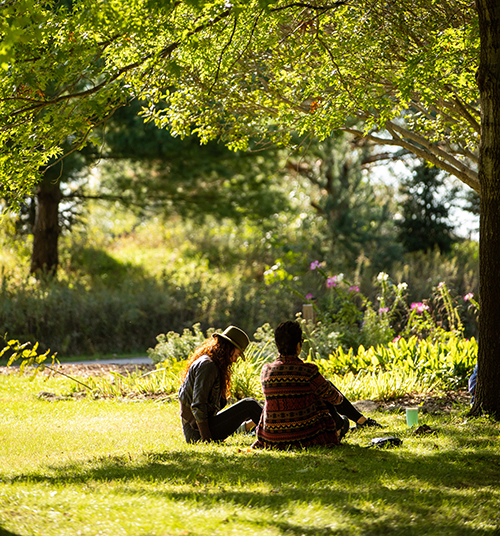 two people enjoying the land at Prairiewoods 