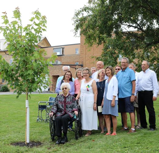 Franciscan Sister of Perpetual Adoration Lydia Wendl and family celebrate tree planting