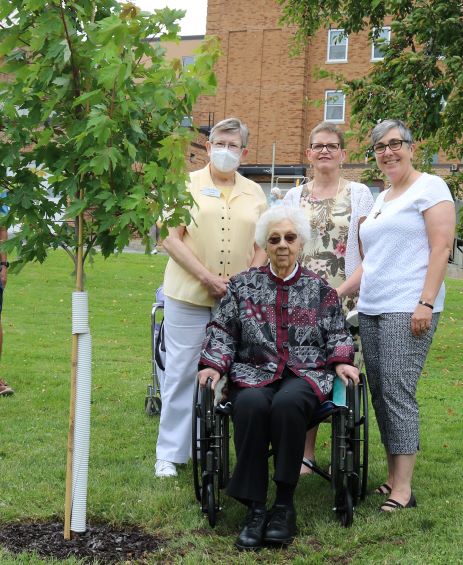 Franciscan Sisters of Perpetual Adoration Lydia Wendl, Julie Tydrich, Sue Ernster and Eileen McKenzie celebrate tree planting