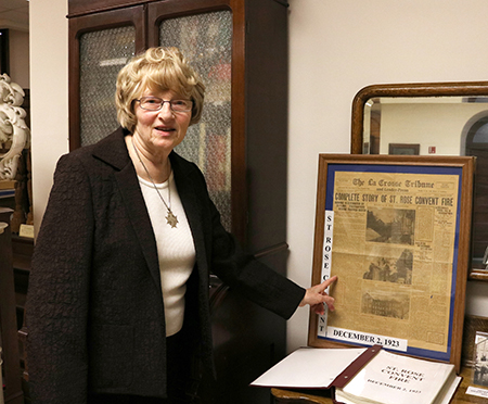 Sister Patricia Tekippe points out an inspiring piece of the article from a December 1923 newspaper article
